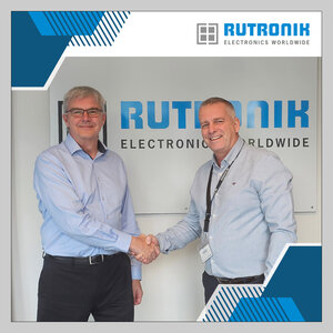 Ron Smith (left) and his successor, Lee Morris (right), shaking hands Ron Smith (left) and his successor, Lee Morris (right), shaking hands